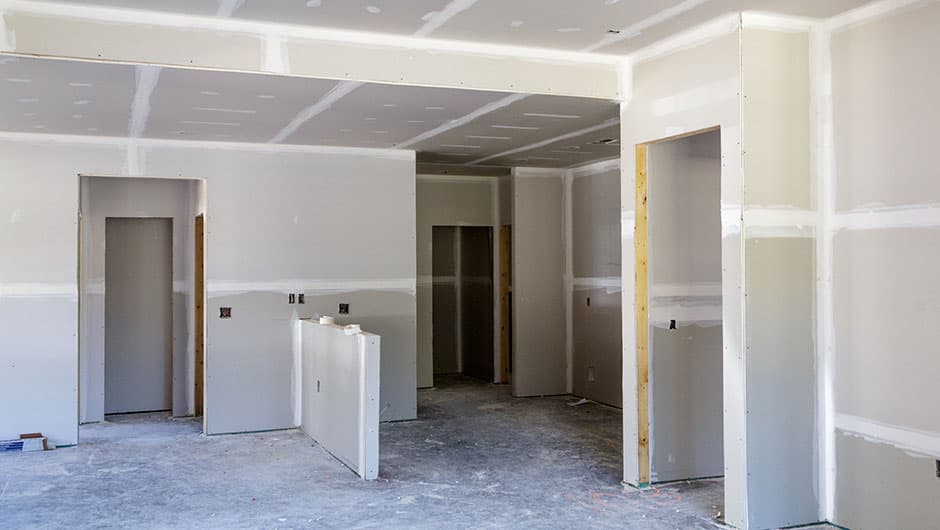 Interior room with drywall installation in progress